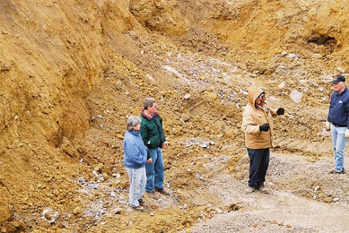 Officials Stand Where House Will Be Located